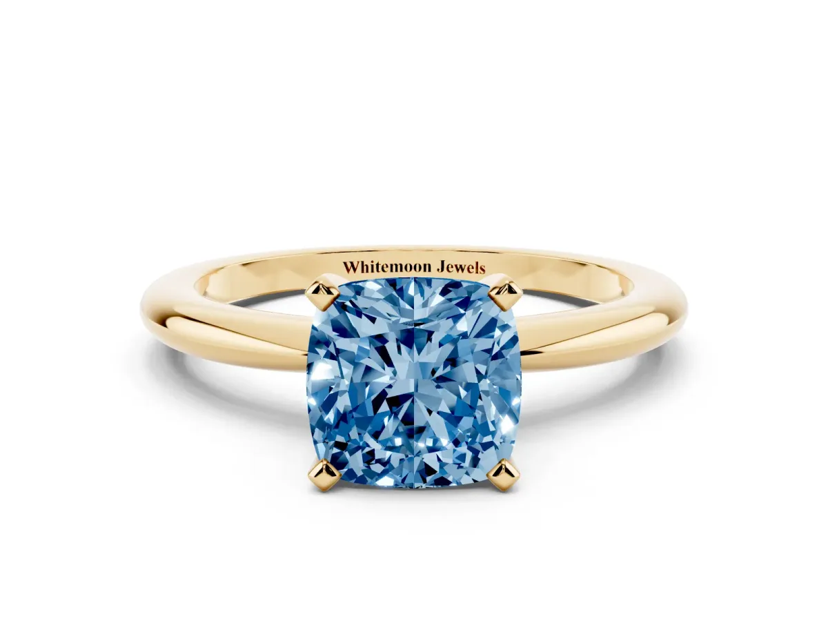 Fancy Blue Cushion Cut Diamond Solitaire Ring with Prong Setting and Classic Band Yellow gold