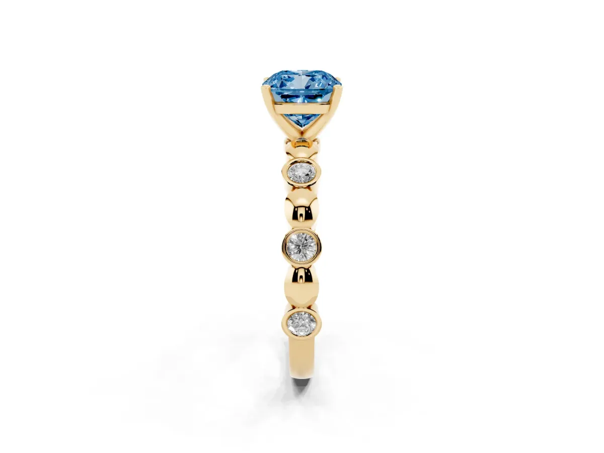 Fancy Blue Cushion Cut Solitaire Bezel-Set Diamond Ring with Beaded Band and Four-Prong Setting Yellow gold