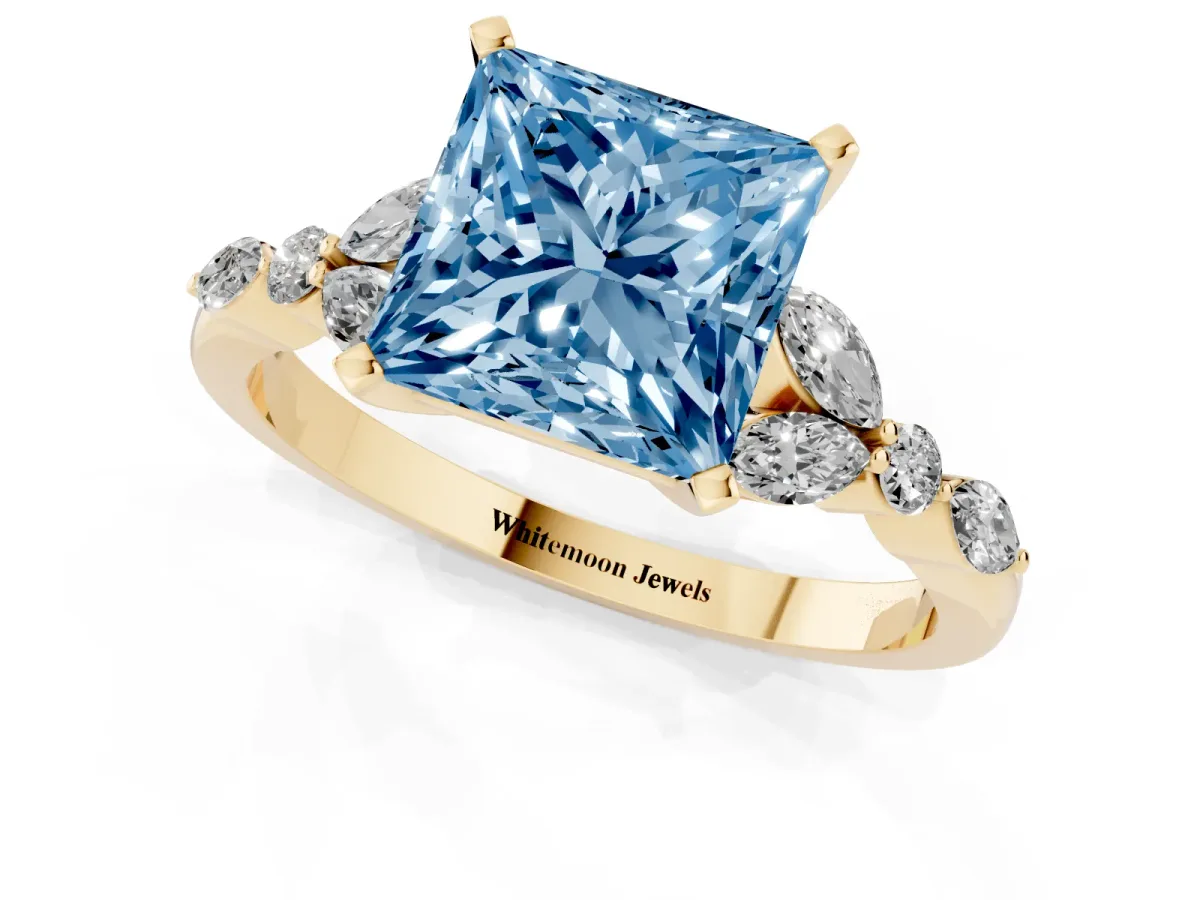 Fancy Blue Princess Cut Diamond Solitaire Ring with Side Stones and Four-Prong Setting Yellow gold
