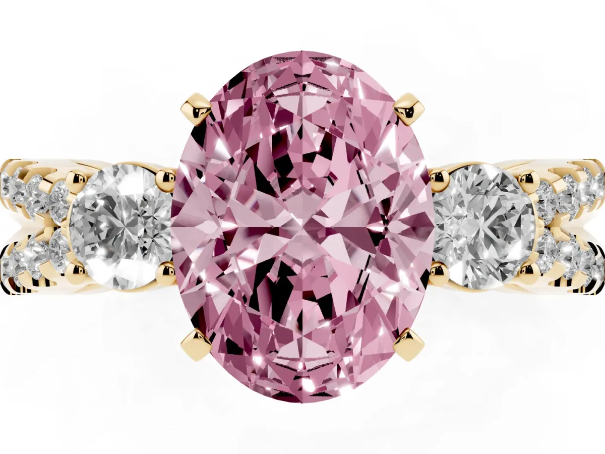 Fancy Pink Oval Cut Diamond Three-Stone Ring with Pavé Split Shank and Four-Prong Setting Yellow gold