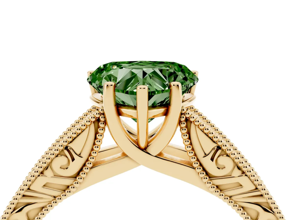 Fancy Green Heart Cut Diamond Solitaire Ring with Engraved Band and Four-Prong Setting Yellow gold