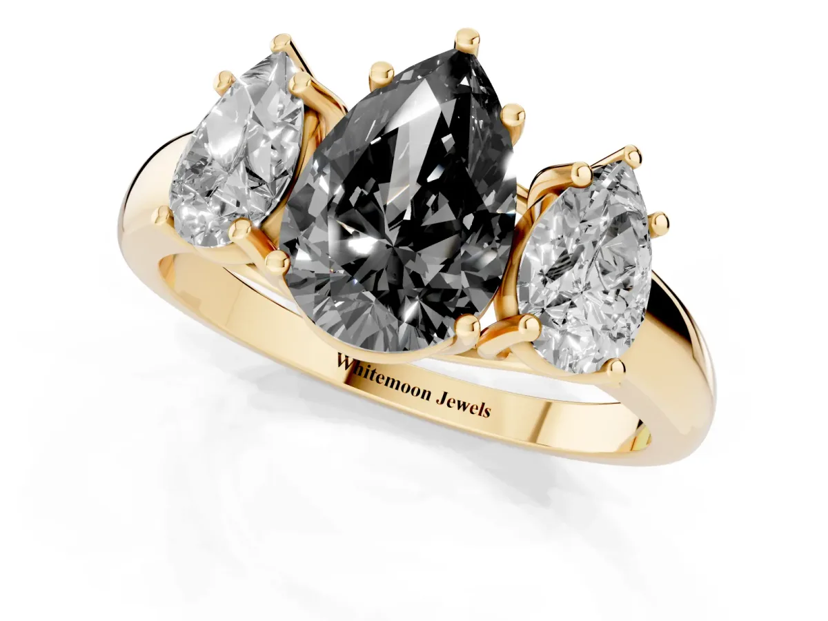 Fancy Black Three-Stone Pear Cut Diamond Engagement Ring with Prong Setting Yellow gold