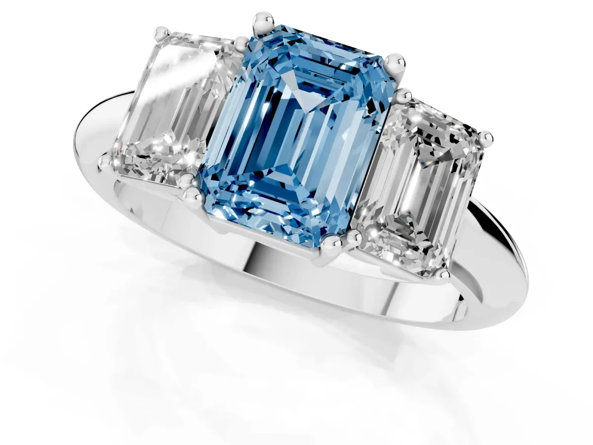 Fancy Blue Three-Stone Emerald Cut Cut Diamond Engagement Ring with Prong Setting on a White Gold Band White gold