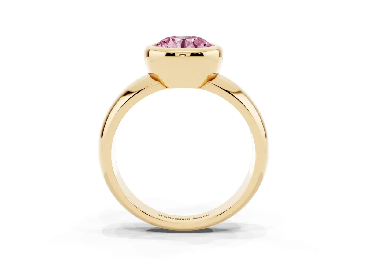 Fancy Pink Bezel Set Round Cut Solitaire Ring with Wide Band Yellow gold