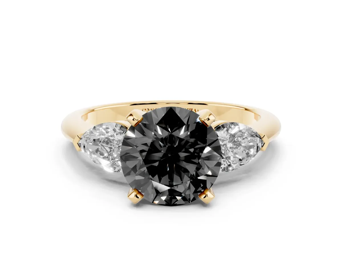 Fancy Black Three-Stone Round Cut Diamond Ring with Pear Side Stones and Four-Prong Setting Yellow gold