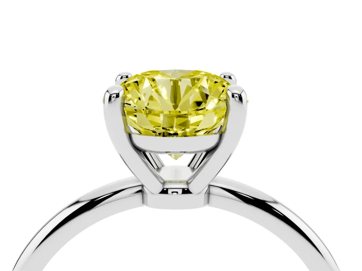 Fancy Yellow Round Cut Solitaire Diamond Ring with 4-Prong Setting on a Classic Band Silver