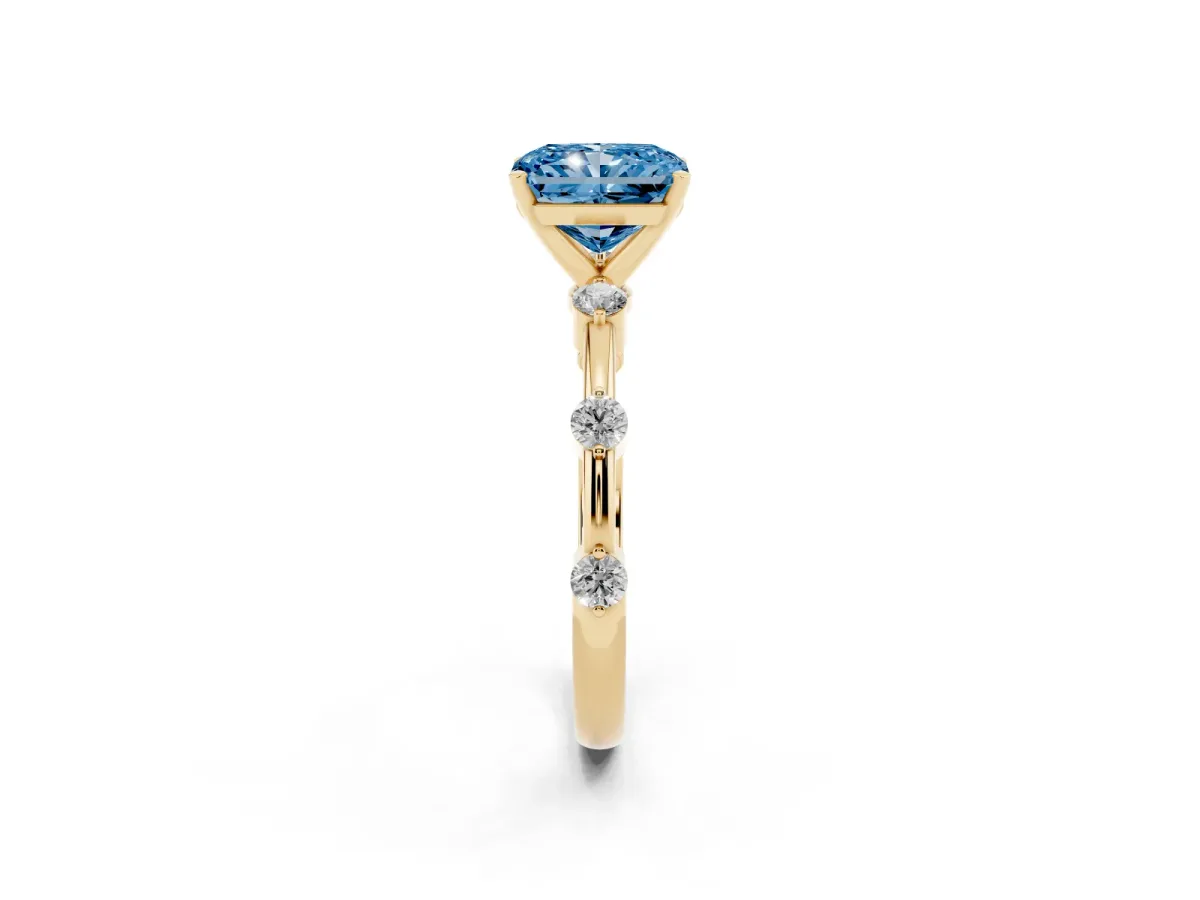 Fancy Blue Radiant Cut Solitaire Diamond Ring with Bezel Set Side Stones and Prong Setting Yellow gold