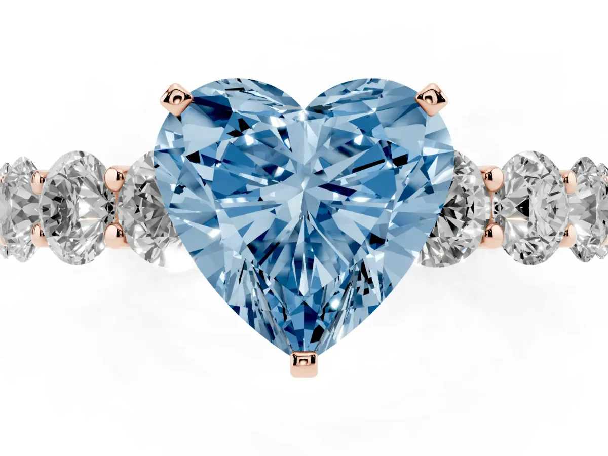 Fancy Blue Heart Cut Diamond Prong Setting with Side Stones on a Pave Band Rose gold