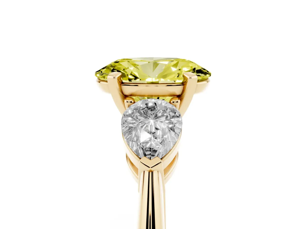 Fancy Yellow Three-Stone Oval Cut Diamond Ring with Pear Side Stones and Four-Prong Setting Yellow gold
