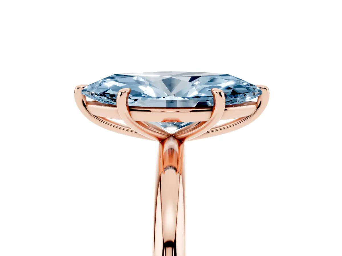 Fancy Blue Oval Cut Solitaire Diamond Ring with Four-Prong Setting on a Plain Band Rose gold