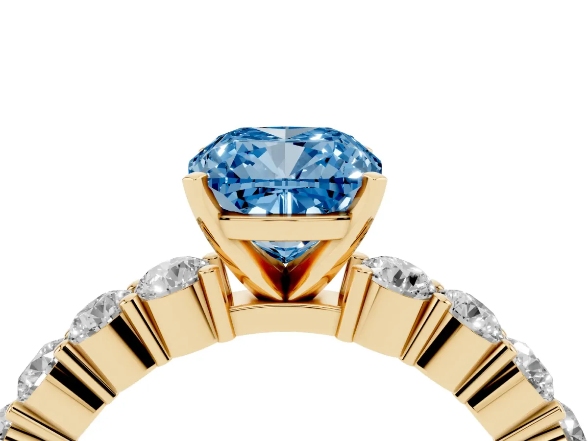 Fancy Blue Cushion Cut Diamond Solitaire Ring with Shared Prong Round Side Stones Yellow gold