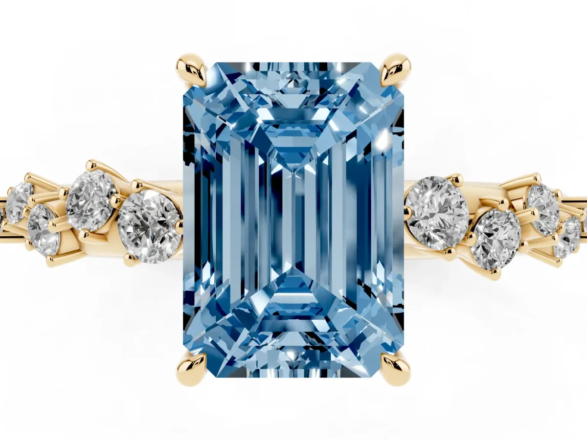 Fancy Blue Emerald Cut Diamond Cluster Side Stone Solitaire Ring with Prong Setting Yellow gold