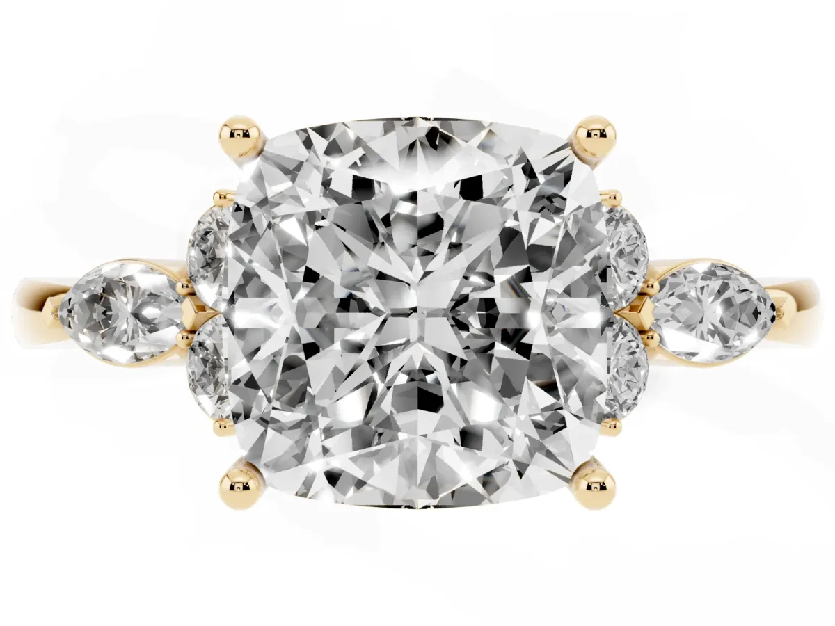 Cushion Cut Brilliant Diamond Solitaire Ring with Pear Side Stones and Four-Prong Setting Yellow gold