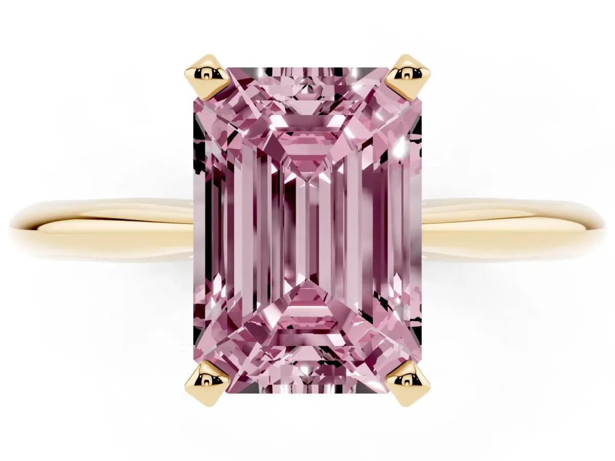 Fancy Pink Emerald Cut Cut Solitaire Ring with Four-Prong Setting on a Classic Band Yellow gold