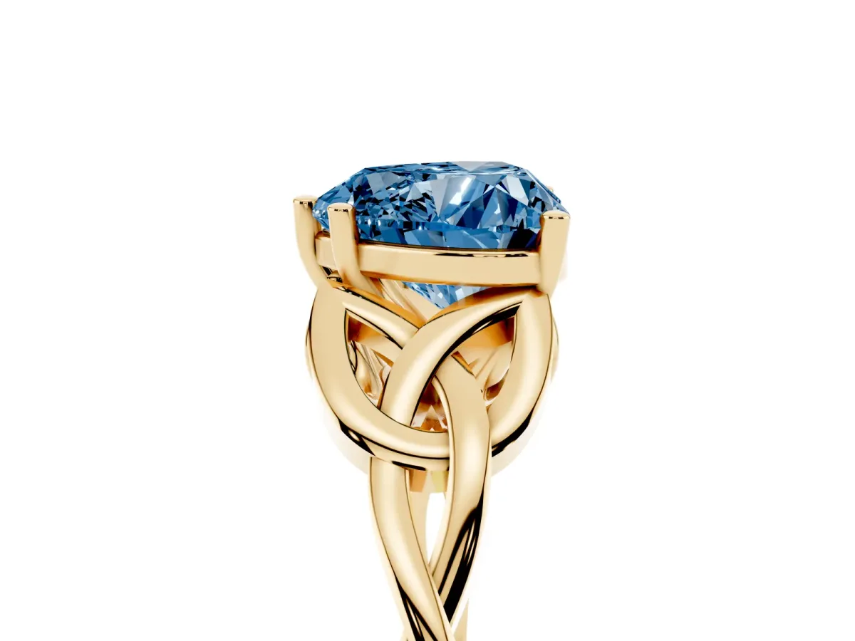Fancy Blue Heart Cut Diamond Solitaire Engagement Ring with Celtic Knot Band and Four-Prong Setting Yellow gold