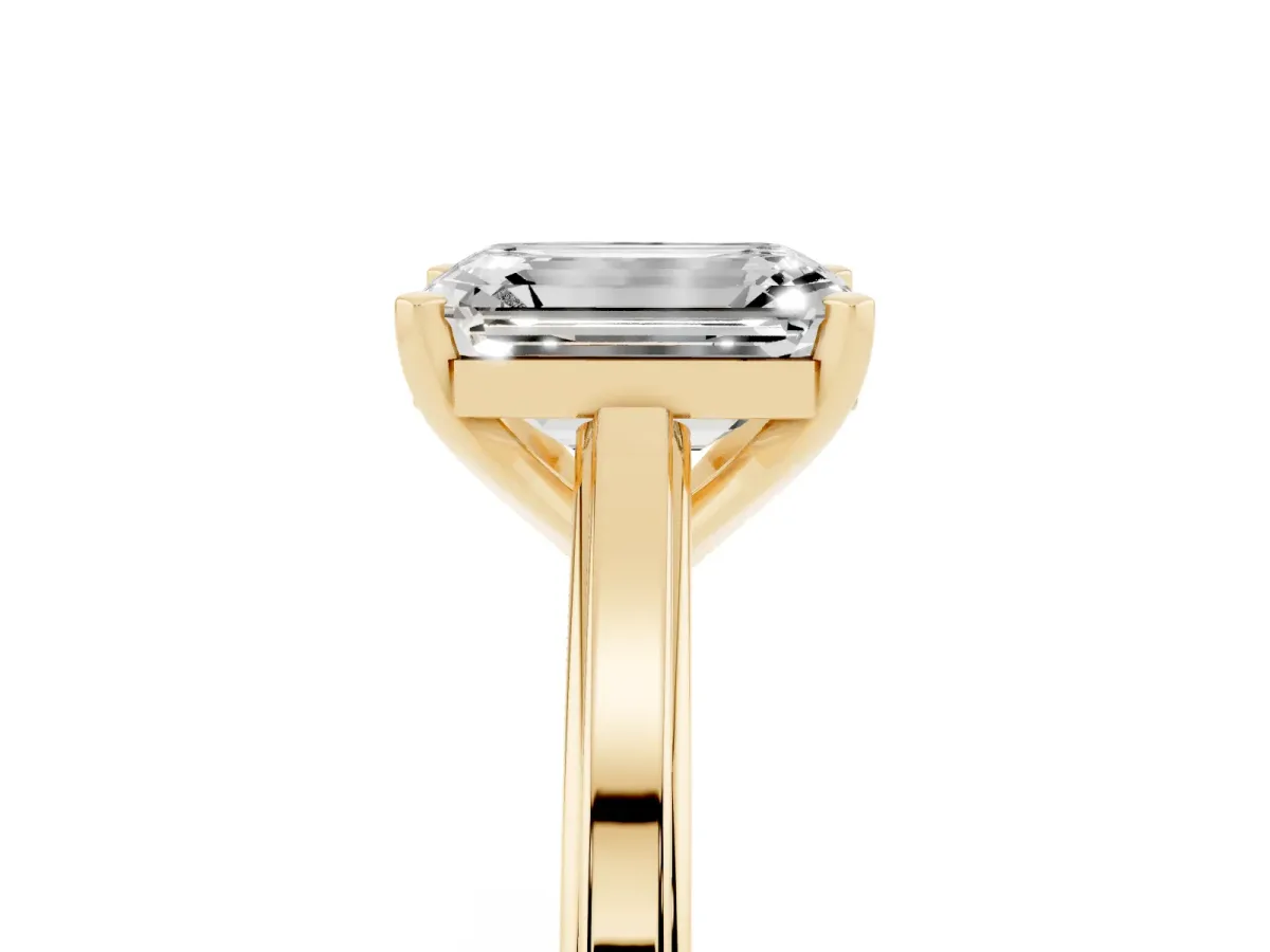 Emerald Cut Solitaire Diamond Ring with Four-Prong Setting and Classic Band Yellow gold