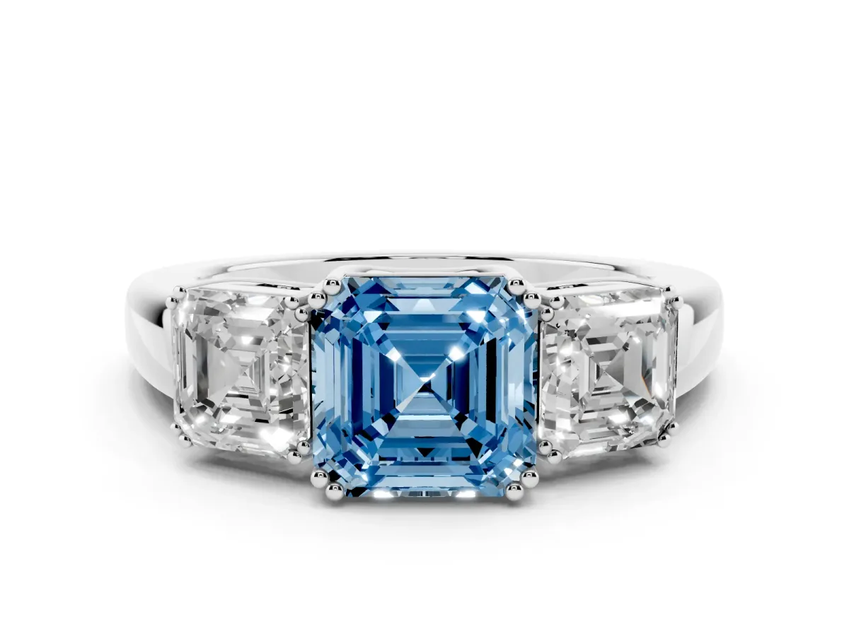 Fancy Blue Three-Stone Asscher Cut Cut Diamond Ring with Channel Set Band and Four-Prong Setting Silver