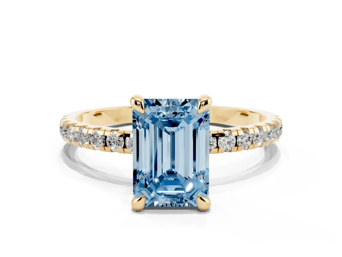 Fancy Blue Emerald Cut Diamond Brilliant Solitaire Ring with Pavé Band and Four-Prong Setting Yellow gold
