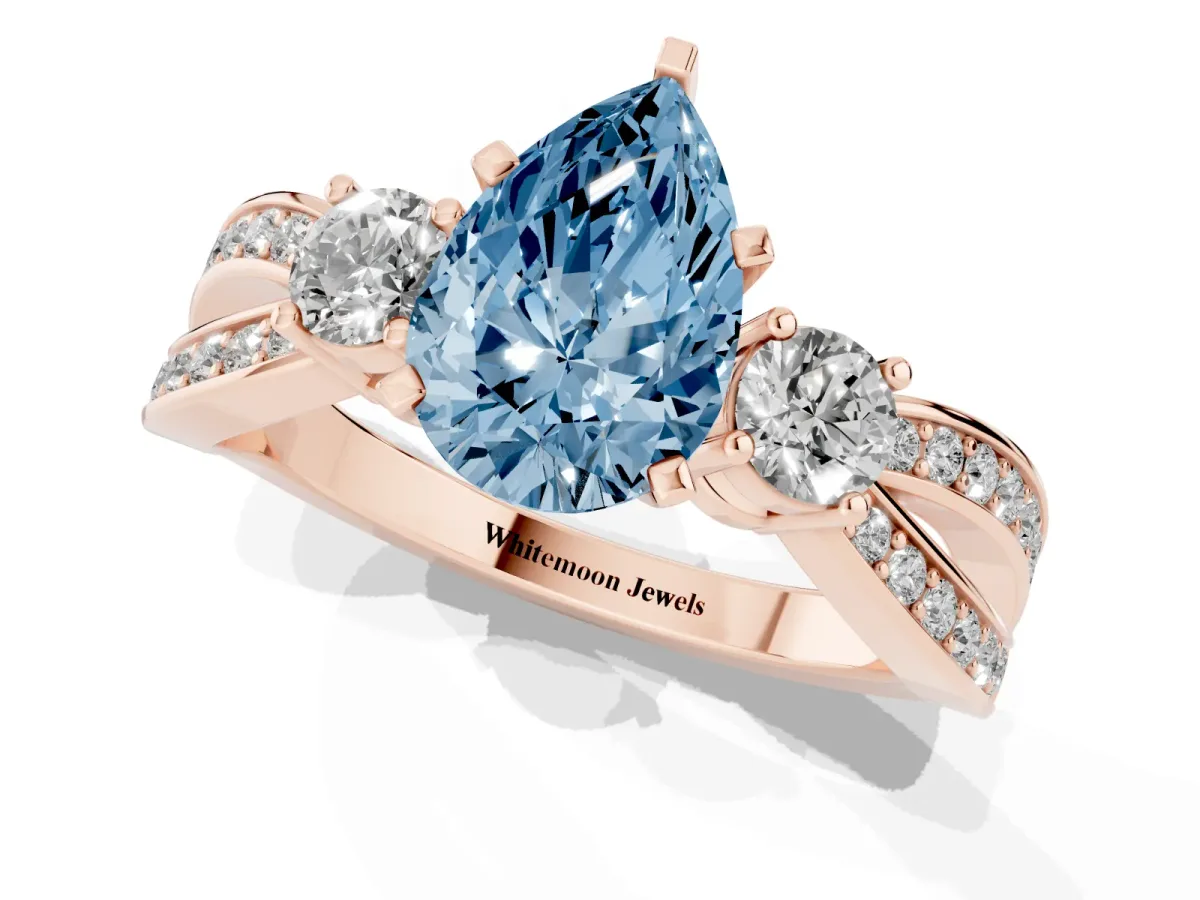 Fancy Blue Three-Stone Pear Cut Cut Diamond Twist Band with Prong Setting Rose gold