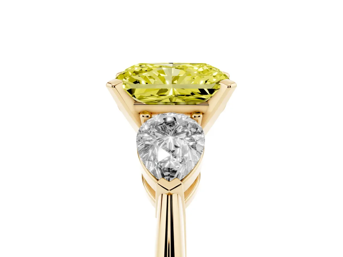 Fancy Yellow Three-Stone Radiant Cut Diamond Ring with Pear Side Stones and Four-Prong Setting Yellow gold