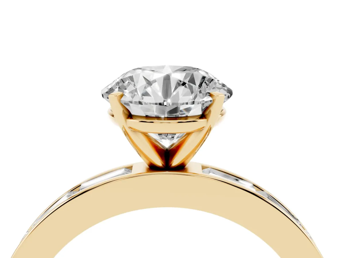 Round Cut Solitaire Diamond Ring with Channel-Set Baguette Band and Four-Prong Setting Yellow gold