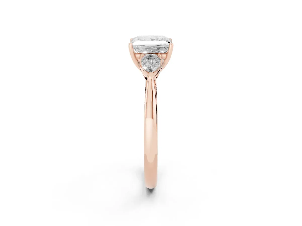 Three-Stone Princess Cut Diamond Ring with Pear Side Stones in Four-Prong Setting Rose gold