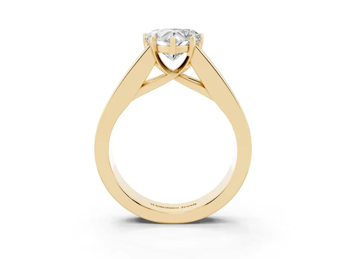Heart Cut Cut Channel Set Solitaire Ring with Four-Prong Setting Yellow gold