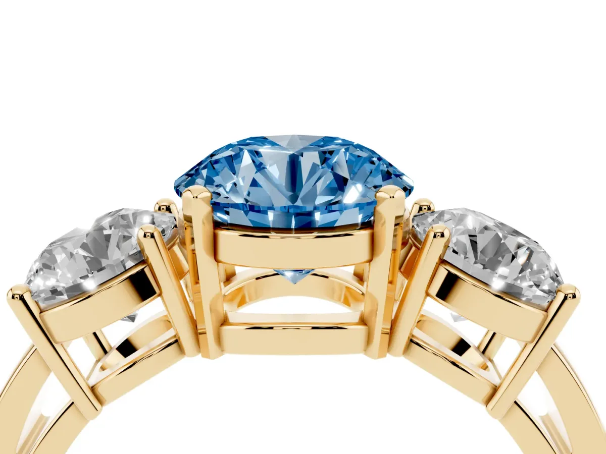 Fancy Blue Three-Stone Round Cut Diamond Ring with Round Side Stones, Classic Band, and Four-Prong Setting Yellow gold