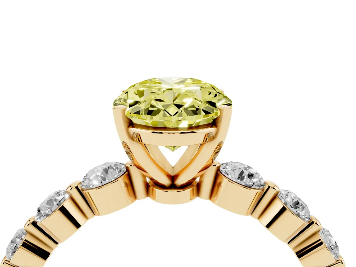 Fancy Yellow Oval Cut Solitaire Diamond Ring with Pave Band and Four-Prong Setting Yellow gold