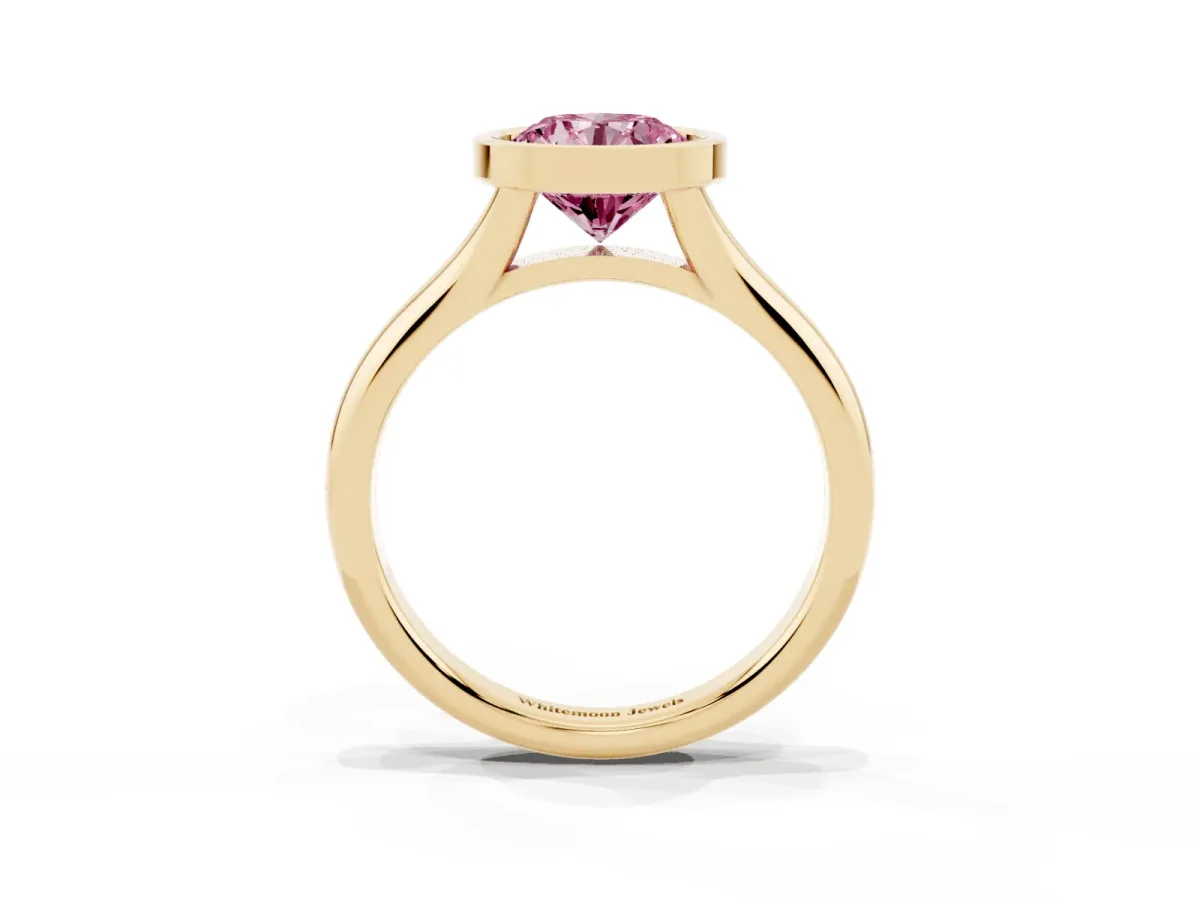 Fancy Pink Bezel Set Round Cut Solitaire Diamond Ring with Smooth Band Yellow gold