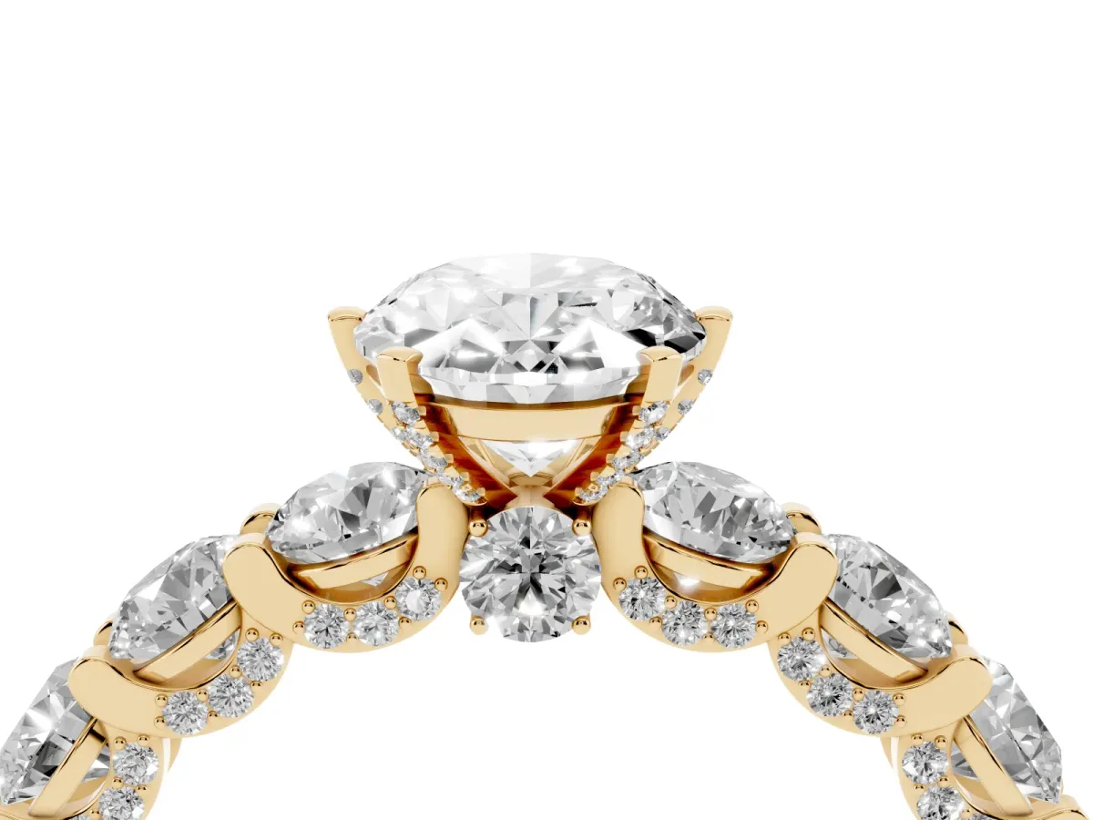 Oval Cut Diamond Side Stone Engagement Ring with Four-Prong Setting Yellow gold