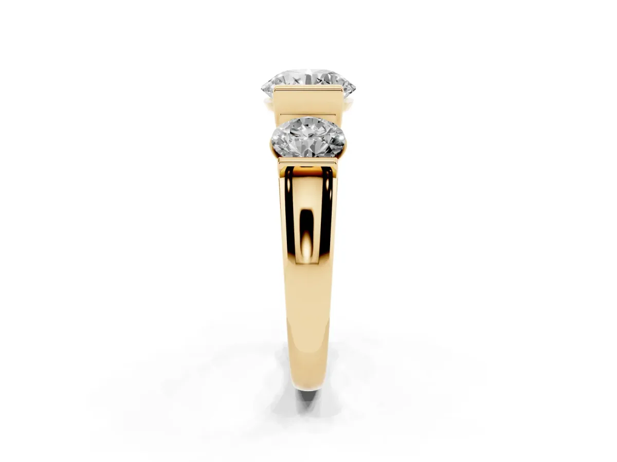 Three-Stone Round Cut Brilliant Diamond Ring with Channel Setting and White Gold Band Yellow gold