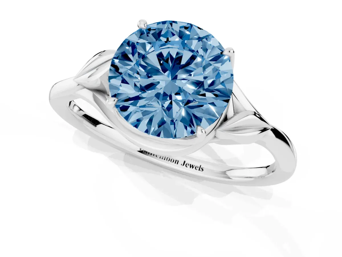 Fancy Blue Round Cut Diamond Solitaire Ring with Twist Band and Four-Prong Setting Silver