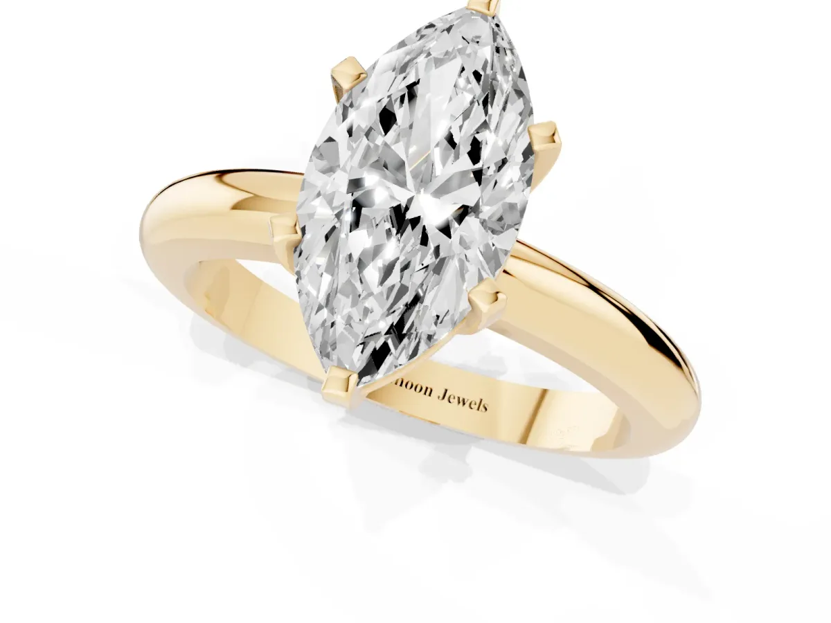 Marquise Cut Diamond Solitaire Engagement Ring with Round Band and Four-Prong Setting Yellow gold