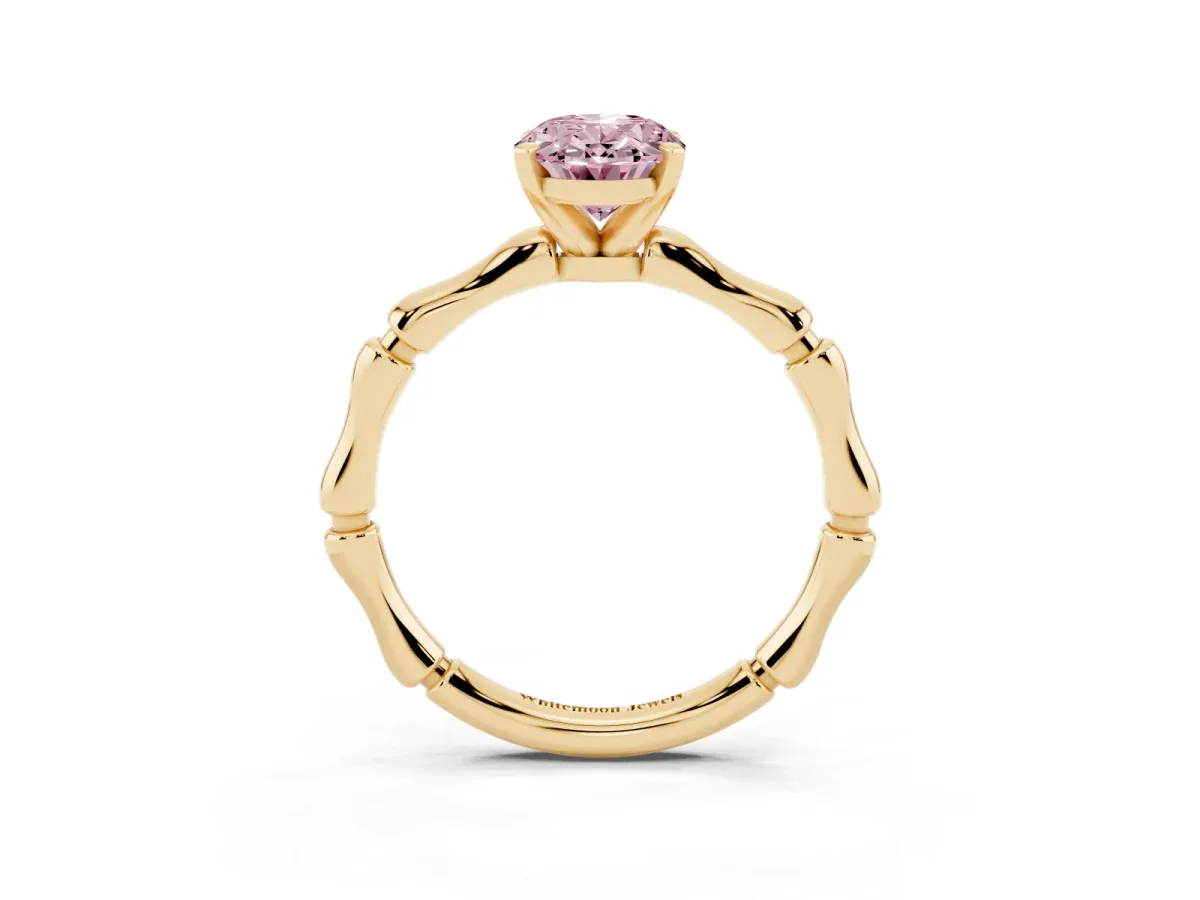 Fancy Pink Oval Cut Solitaire Diamond Ring with Bamboo Band and Four-Prong Setting Yellow gold