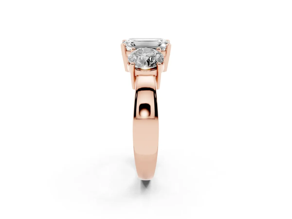 Three-Stone Emerald Cut Diamond Ring with Round Side Stones, Classic Band, and Four-Prong Setting Rose gold