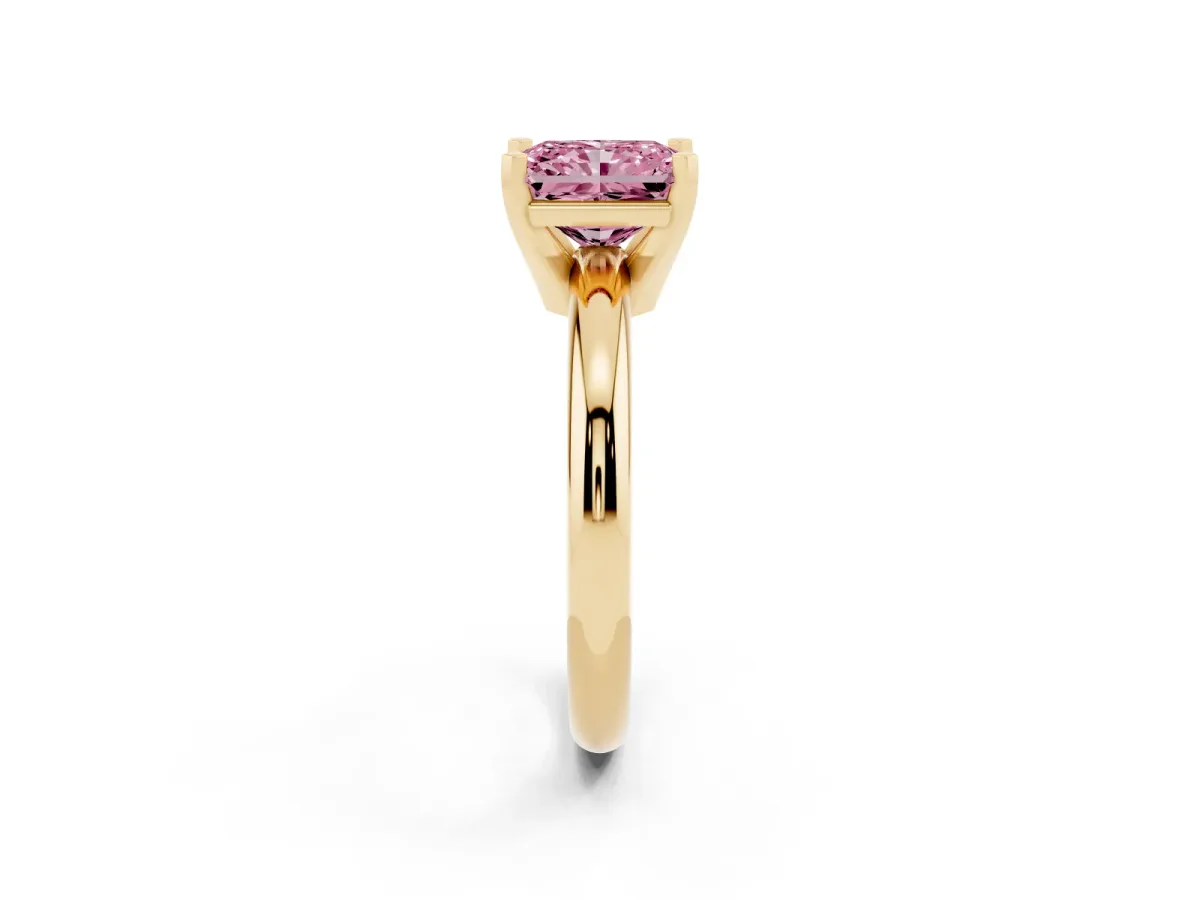 Fancy Pink Radiant Cut Diamond Solitaire Engagement Ring with Round Band and Four-Prong Setting Yellow gold