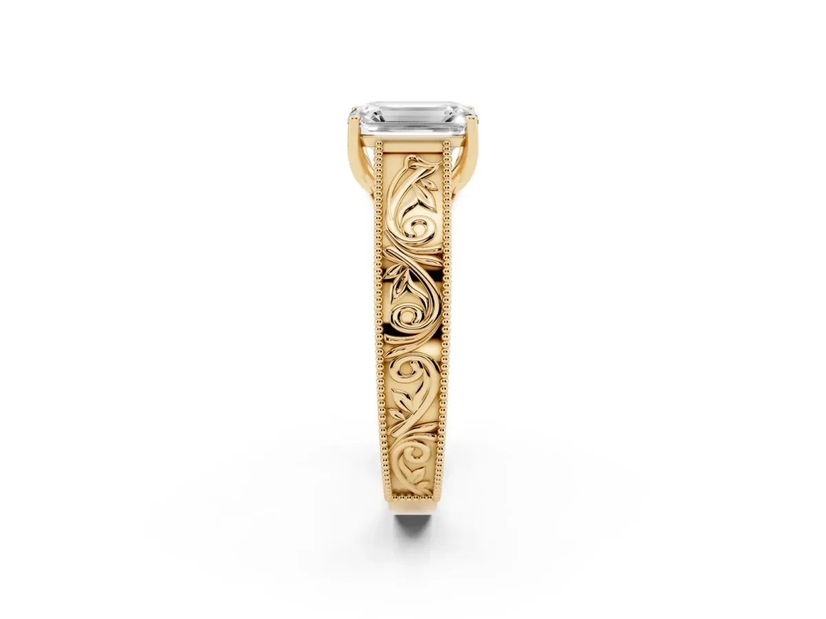 Emerald Cut Diamond Solitaire Ring with Engraved Band and Four-Prong Setting Yellow gold