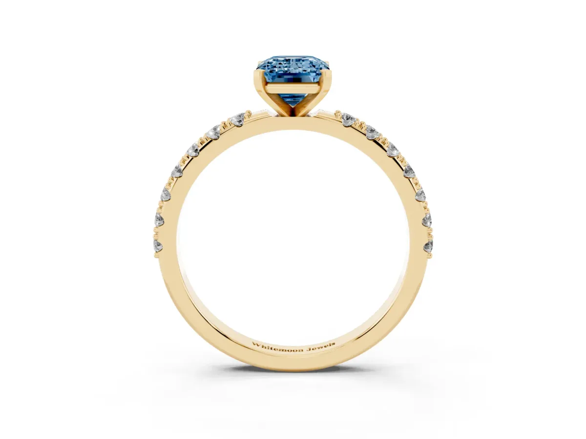 Fancy Blue Emerald Cut Diamond Solitaire Pavé Band with Four-Prong Setting Yellow gold