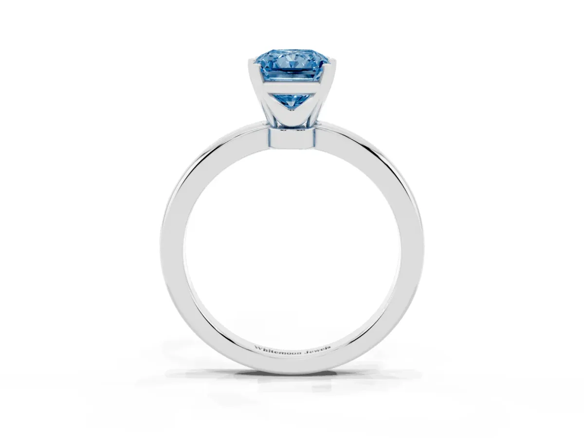 Fancy Blue Radiant Cut Solitaire Diamond Ring with Six-Prong Setting on a Classic Band Silver