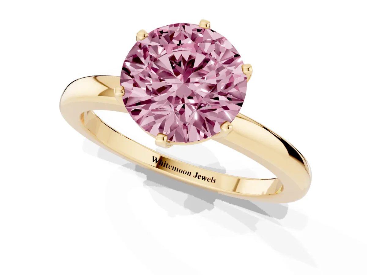 Fancy Pink Round Cut Solitaire Diamond Ring with Six-Prong Setting on a Classic Band Yellow gold