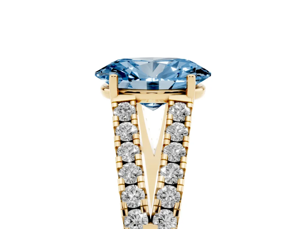 Fancy Blue Oval Cut Diamond Split Shank Pavé Engagement Ring with Four-Prong Setting Yellow gold
