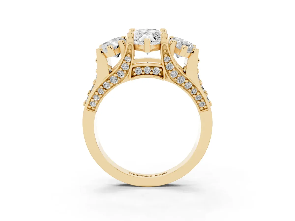 Marquise Cut Diamond Three-Stone Ring with Channel Set Band and Four-Prong Setting Yellow gold