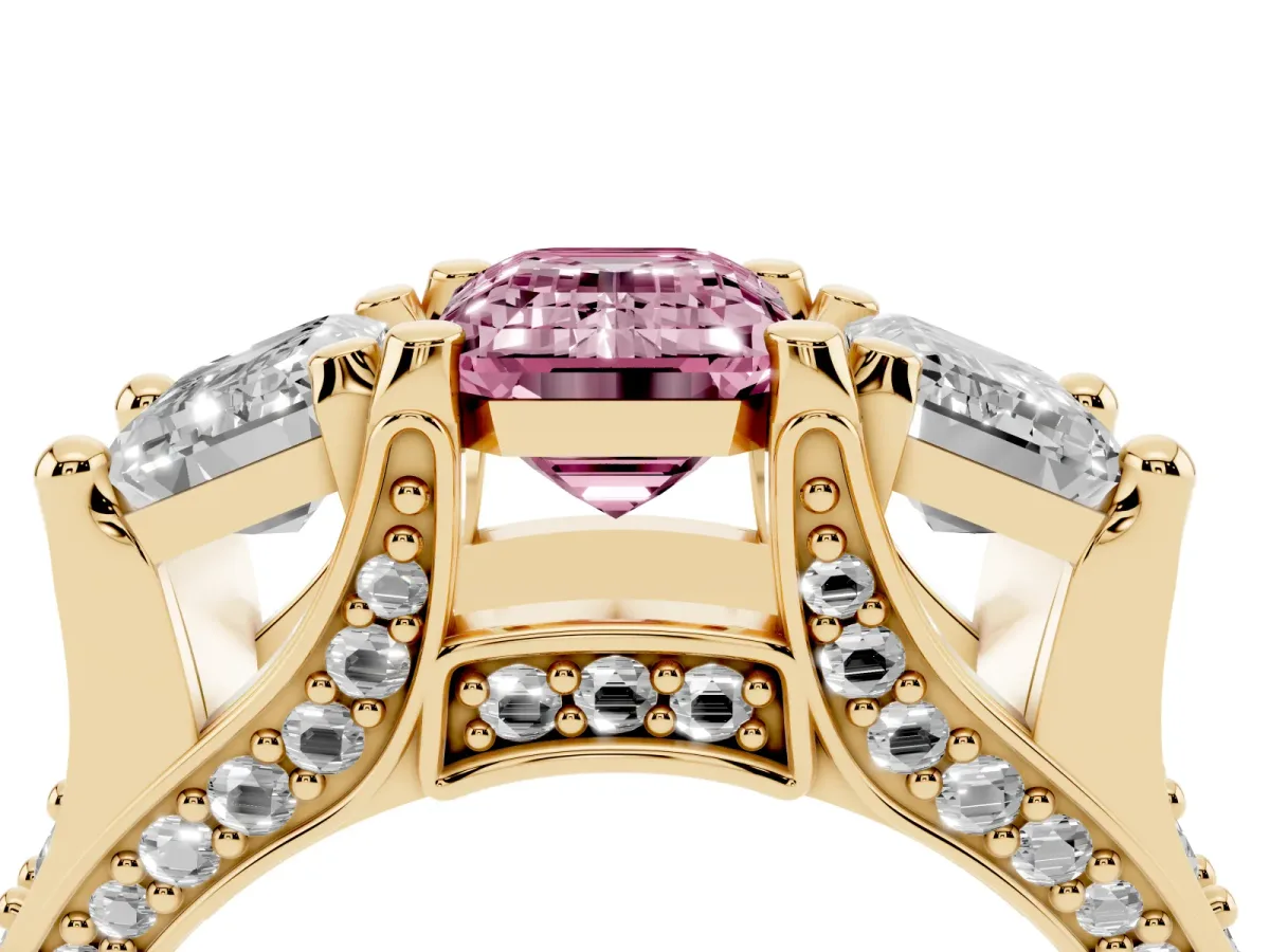 Fancy Pink Emerald Cut Diamond Three-Stone Ring with Channel Set Band and Four-Prong Setting Yellow gold