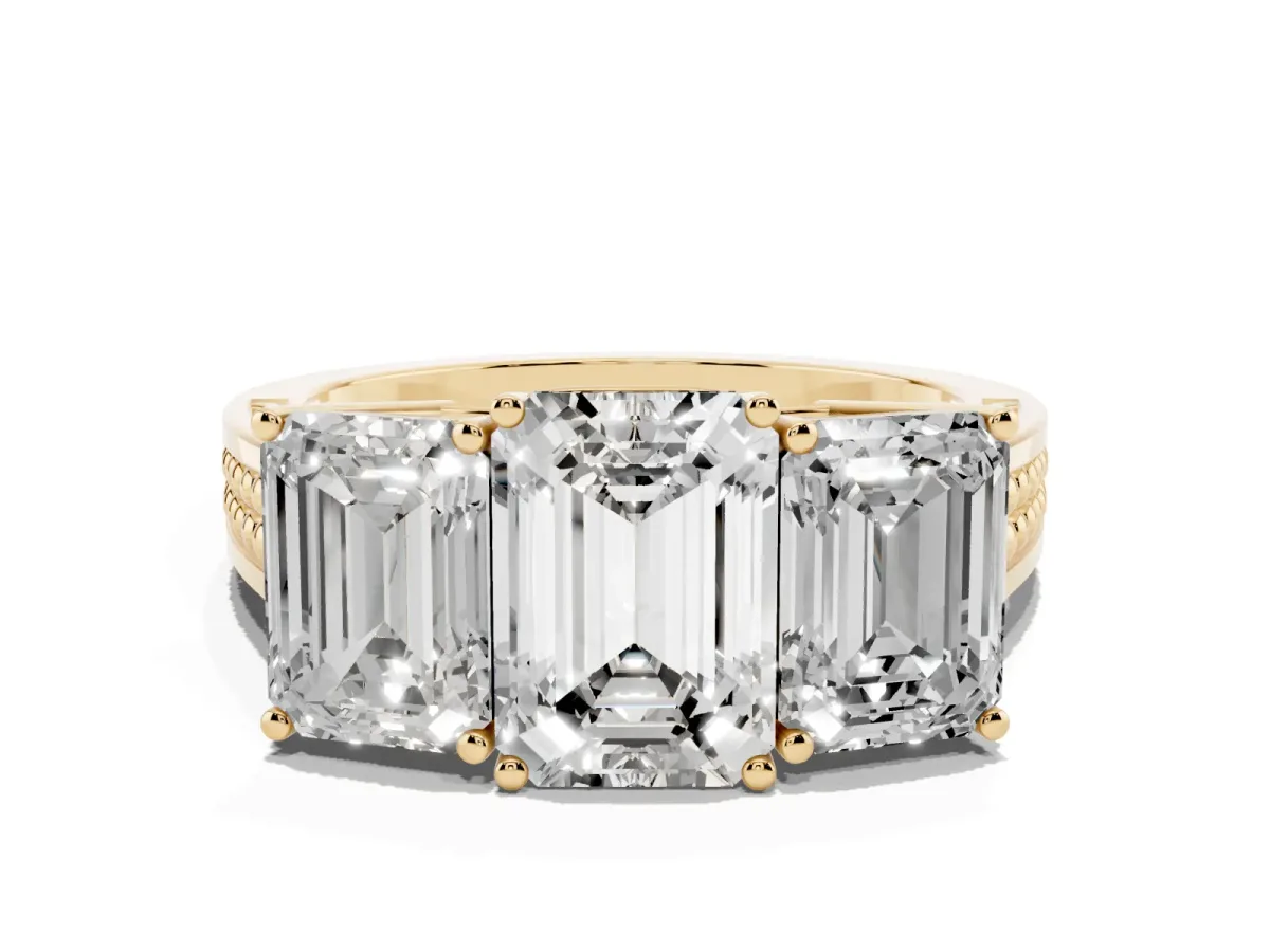 Emerald Cut Diamond Three-Stone Ring with Prong Setting and Textured Band Yellow gold