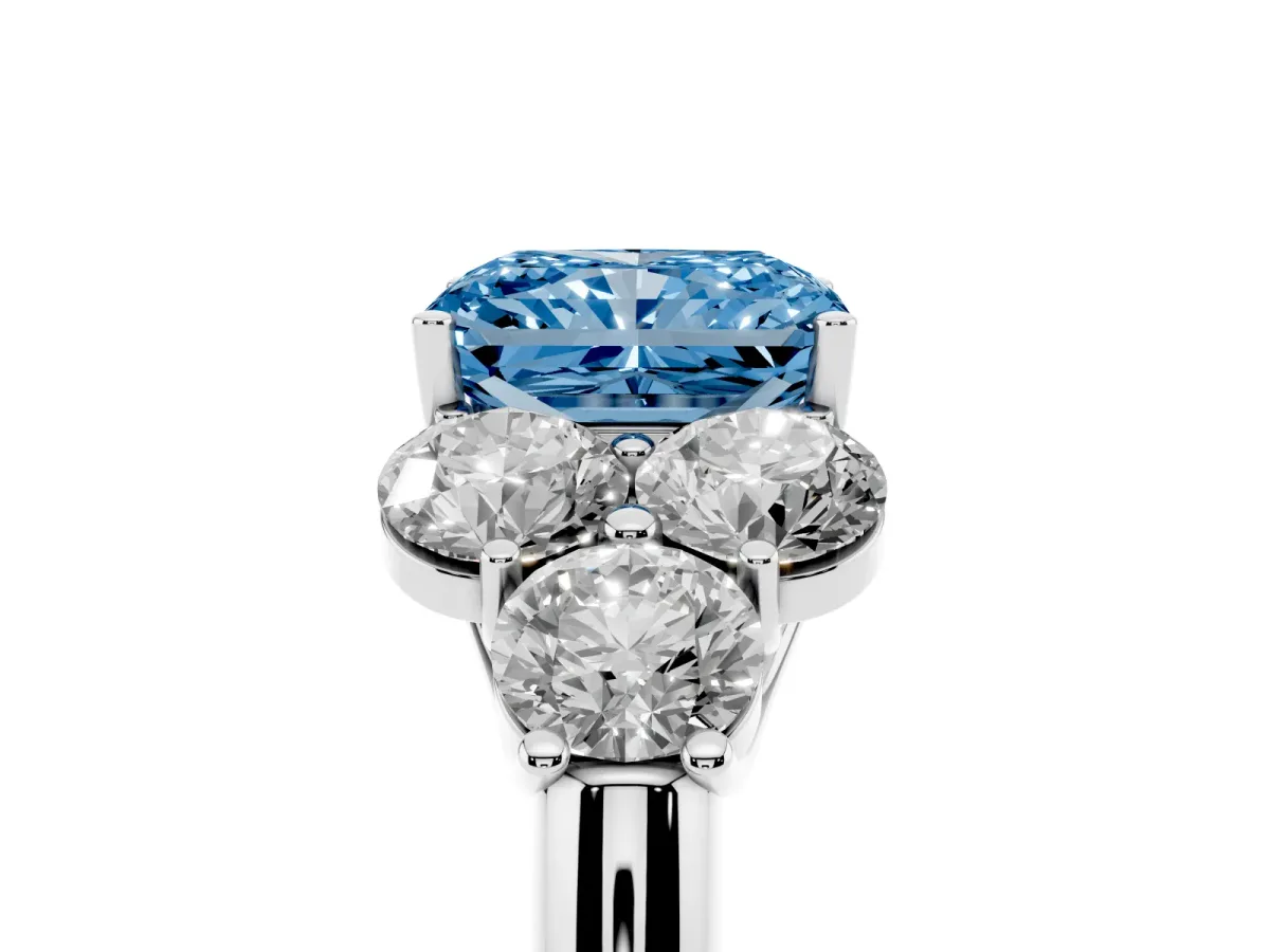 Fancy Blue Radiant Cut Cut Diamond Cluster Ring with Round Accent Stones and Prong Setting on a Classic Band White gold