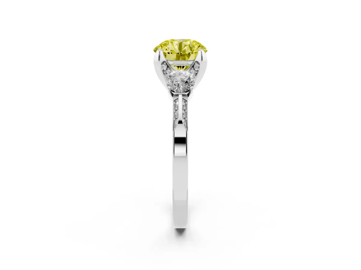 Fancy Yellow Round Cut Brilliant Three-Stone Diamond Ring with Pavé Band and Four-Prong Setting Platinum