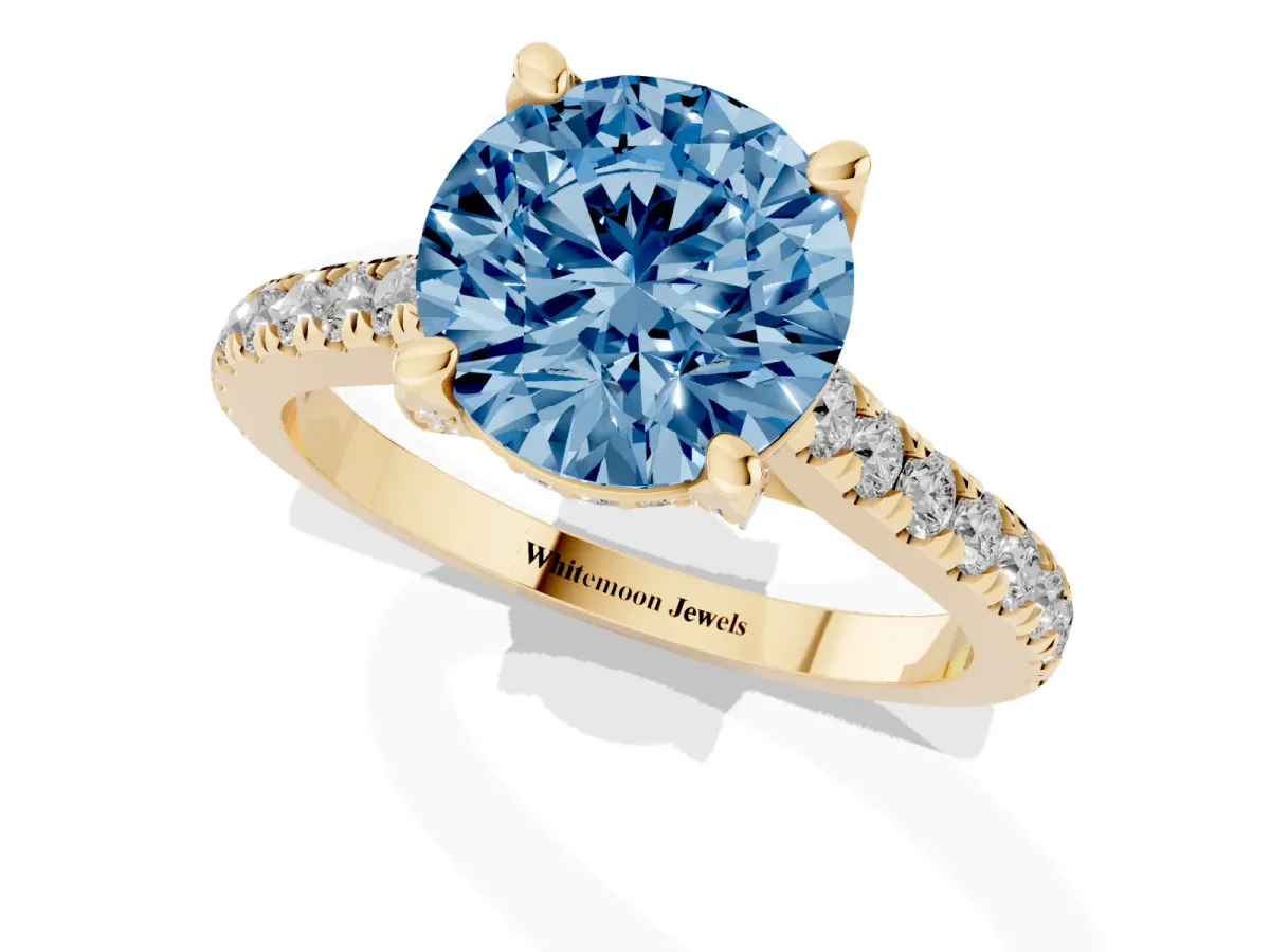 Fancy Blue Round Cut Brilliant Diamond Solitaire with Pavé Band and Four-Prong Setting Yellow gold