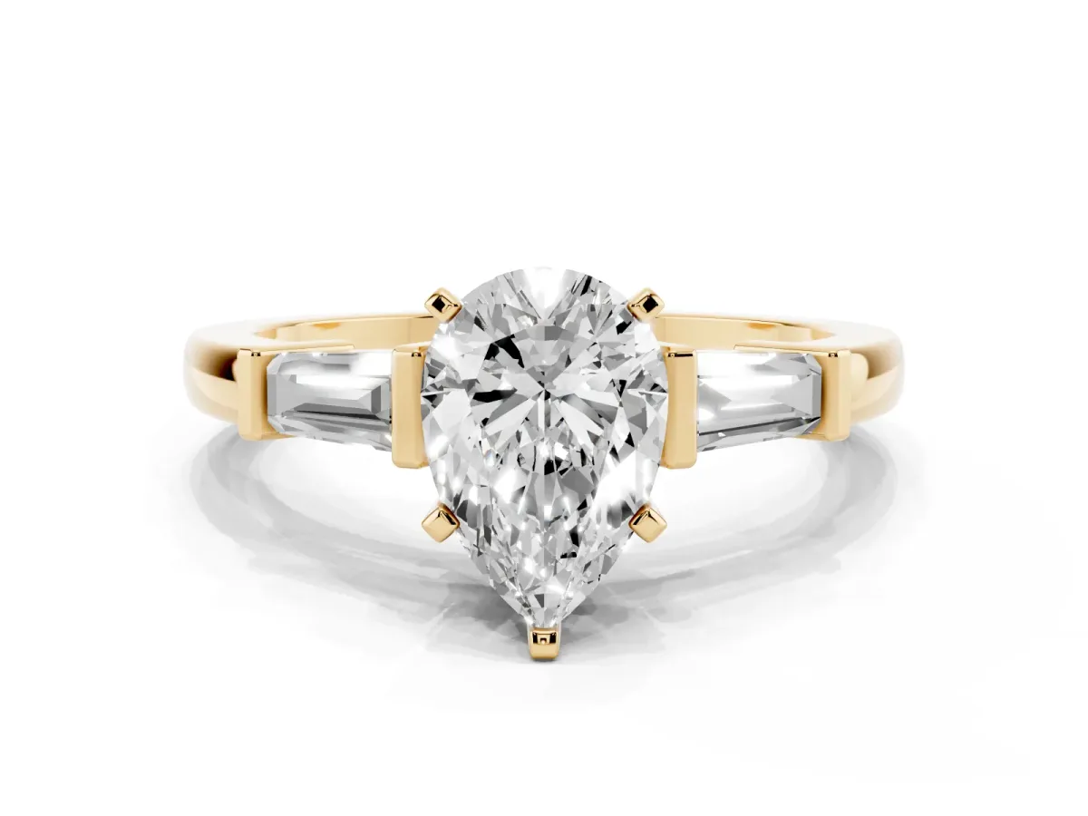 Pear Cut Cut Diamond Solitaire Ring with Tapered Baguette Accents and Four-Prong Setting Yellow gold