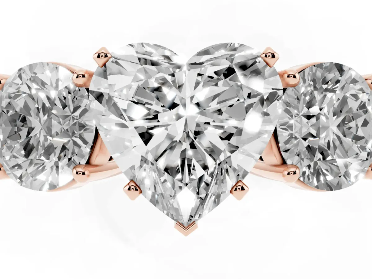 Three-Stone Heart Cut Diamond Ring with Round Side Stones, Classic Band, and Four-Prong Setting Rose gold